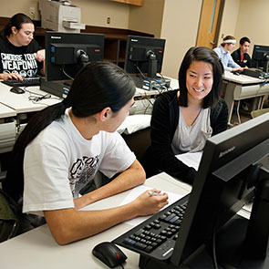Students working together at a computer. Read about Gifts of Appreciated Securities