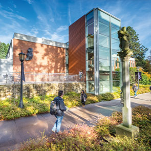 Students walking in front of campus building.Read about Gifts of Cash, Checks, and Credit Cards 