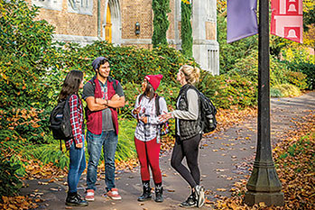 Photo of students standing on fall campus
